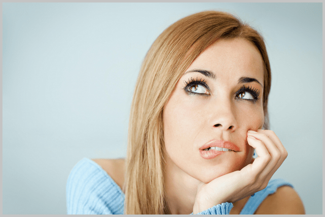 The girl considers choosing a gel to treat varicose veins